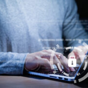 Programmer typing working laptop programming about cyber security