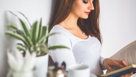 Young woman relaxing at home and reading a book 6382