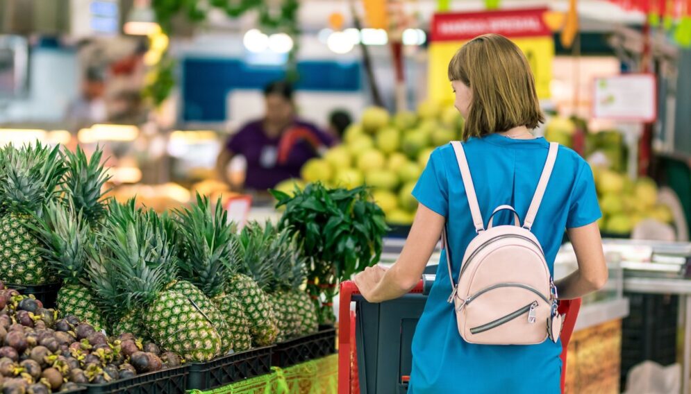 Woman standing beside pineapple fruits 2292919