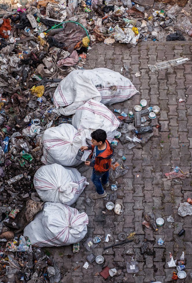 Child standing near garbage 2263405