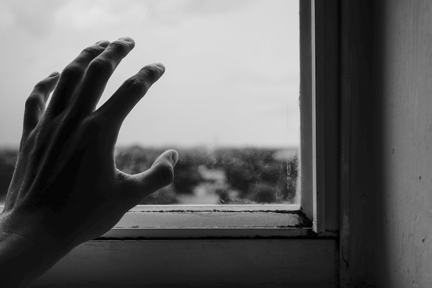 Close up photography of hand near window 1264438